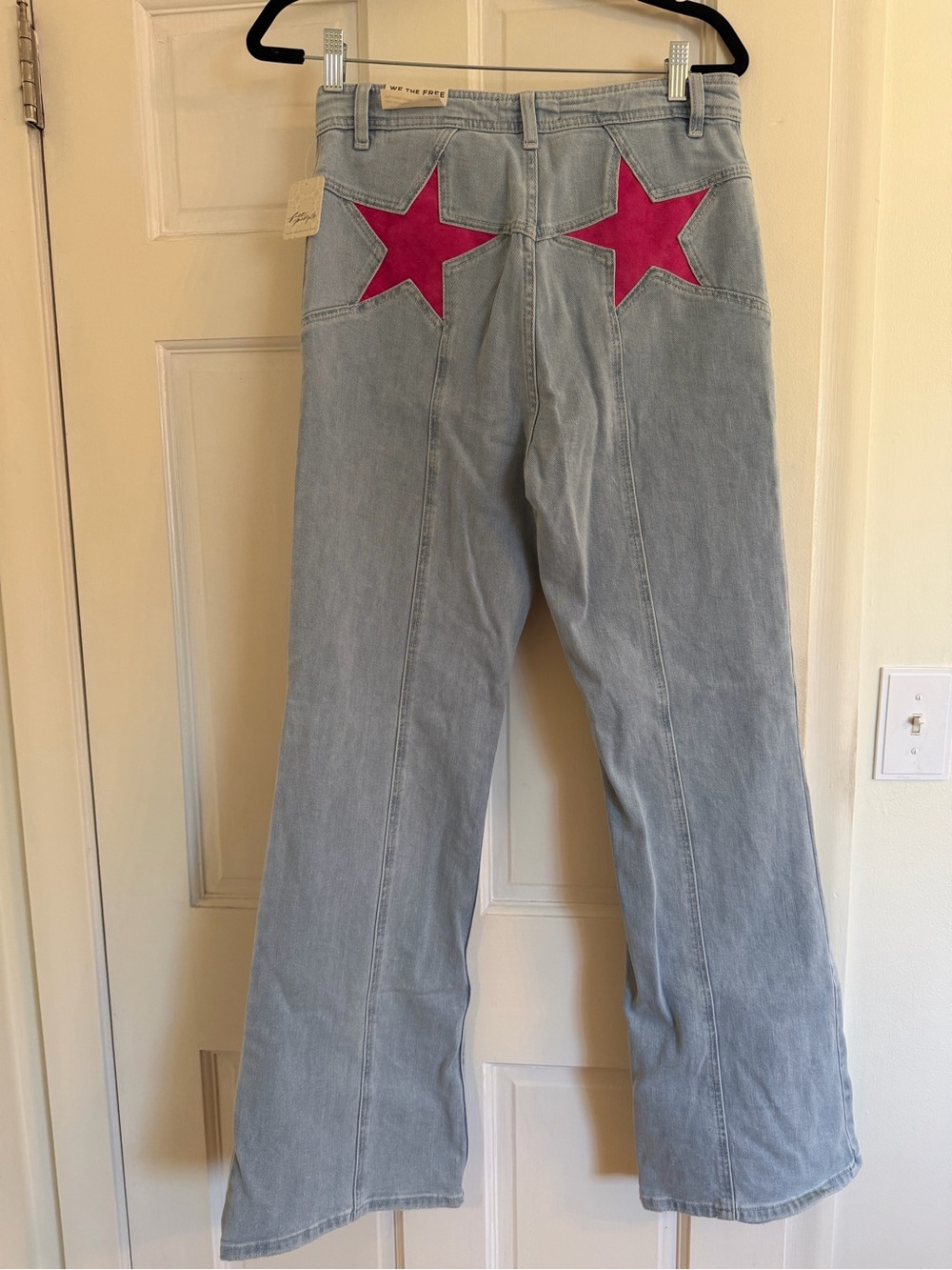 Free People High-Rise Light Wash Jeans with Pink Star Patches
